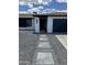 Modern entryway with walkway and dark-colored garage door at 941 W Peralta Ave, Mesa, AZ 85210