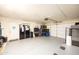 Spacious garage with an epoxy floor, ample storage space, and a functional work area at 941 W Peralta Ave, Mesa, AZ 85210