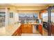 Bright kitchen featuring granite countertops, stainless steel appliances, and a view to the outside deck at 941 W Peralta Ave, Mesa, AZ 85210