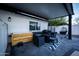 Covered patio with seating area, creating an inviting outdoor space at 941 W Peralta Ave, Mesa, AZ 85210