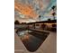 Inviting pool and patio area with stunning sunset views at 941 W Peralta Ave, Mesa, AZ 85210