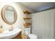 Bathroom with a sink, toilet, shower and decorative mirror at 9431 E Coralbell Ave # 198, Mesa, AZ 85208