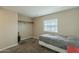 Cozy bedroom with neutral carpet, natural lighting, and closet space at 9431 E Coralbell Ave # 198, Mesa, AZ 85208