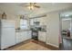 Functional kitchen featuring white cabinetry and appliances at 9431 E Coralbell Ave # 198, Mesa, AZ 85208