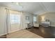 Inviting living room with hardwood floors, neutral-toned walls, and ample natural light from a large window at 9431 E Coralbell Ave # 198, Mesa, AZ 85208