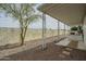 Side view of an outdoor patio area with gravel, a wall and seating at 9431 E Coralbell Ave # 198, Mesa, AZ 85208