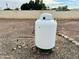 White propane tank in gravel area at 9431 E Coralbell Ave, Mesa, AZ 85208