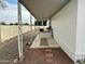 Covered patio area of a manufactured home with gravel and rock landscaping at 9431 E Coralbell Ave, Mesa, AZ 85208