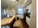 Modern kitchen featuring white cabinets and a kitchen island at 9431 E Coralbell Ave, Mesa, AZ 85208