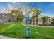 Clean community park with grassy area, dog waste station, and trash receptacle at 9862 E Flower Ave, Mesa, AZ 85208