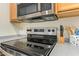 Stainless steel stove top and microwave at 9862 E Flower Ave, Mesa, AZ 85208