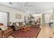 Spacious living room with brown couches and a coffee table at 9862 E Flower Ave, Mesa, AZ 85208