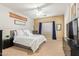 Spacious main bedroom with a king-size bed and neutral decor at 9862 E Flower Ave, Mesa, AZ 85208