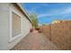 Side yard with gravel pathway and block wall at 9862 E Flower Ave, Mesa, AZ 85208