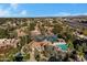 Aerial view showing community, pool, tennis courts, and mountain views at 10101 N Arabian Trl # 2052, Scottsdale, AZ 85258