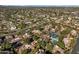 Wide view of community with pool, tennis courts, and distant city views at 10101 N Arabian Trl # 2052, Scottsdale, AZ 85258