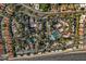 Aerial view of community featuring pools, tennis courts, and ample parking at 10101 N Arabian Trl # 2052, Scottsdale, AZ 85258