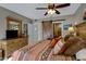 King-size bed in a well-lit bedroom with a barn door at 10101 N Arabian Trl # 2052, Scottsdale, AZ 85258