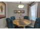 Charming dining area with round table and four chairs at 10101 N Arabian Trl # 2052, Scottsdale, AZ 85258