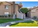 Attractive exterior of a two-story condo building with landscaping and walkways at 10101 N Arabian Trl # 2052, Scottsdale, AZ 85258