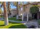 Condo building exterior showing multiple units with walkways and landscaping at 10101 N Arabian Trl # 2052, Scottsdale, AZ 85258