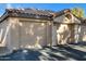 Tan double garage doors with address number visible at 10101 N Arabian Trl # 2052, Scottsdale, AZ 85258