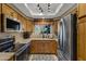 Well-equipped kitchen with wood cabinets and stainless steel appliances at 10101 N Arabian Trl # 2052, Scottsdale, AZ 85258