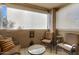 Private patio with seating area and treetop views at 10101 N Arabian Trl # 2052, Scottsdale, AZ 85258