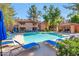Inviting community pool with blue lounge chairs and shaded areas at 10101 N Arabian Trl # 2052, Scottsdale, AZ 85258