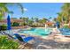 Relaxing community pool with lounge chairs and patio umbrellas at 10101 N Arabian Trl # 2052, Scottsdale, AZ 85258