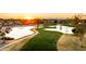 Golf course community with ponds, walking paths, and sunset views at 10242 E Spring Creek Rd, Sun Lakes, AZ 85248