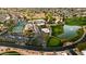 Community clubhouse with pool, tennis courts, and ample parking at 10242 E Spring Creek Rd, Sun Lakes, AZ 85248