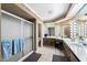Bright bathroom with double vanity, shower, and large mirror at 10242 E Spring Creek Rd, Sun Lakes, AZ 85248