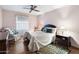 Cozy bedroom featuring a double bed and wood flooring at 10242 E Spring Creek Rd, Sun Lakes, AZ 85248