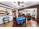 Wood-floored dining room with table, chairs, and views into living room at 10242 E Spring Creek Rd, Sun Lakes, AZ 85248