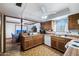 Kitchen with wood cabinets, tile floor, and white appliances at 10242 E Spring Creek Rd, Sun Lakes, AZ 85248