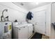 Laundry room with washer, dryer, and exterior access at 10242 E Spring Creek Rd, Sun Lakes, AZ 85248