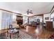 Spacious living room with fireplace, hardwood floors, and comfy seating at 10242 E Spring Creek Rd, Sun Lakes, AZ 85248