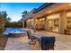 Outdoor patio with seating area, pool, and spa, ideal for entertaining at 12519 W Bajada Rd, Peoria, AZ 85383