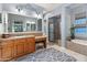 Elegant bathroom with double vanity, soaking tub, and shower at 12519 W Bajada Rd, Peoria, AZ 85383
