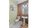 Stylish powder room with pedestal sink and patterned walls at 12519 W Bajada Rd, Peoria, AZ 85383