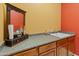 Clean bathroom vanity with mirror and wooden cabinets at 12519 W Bajada Rd, Peoria, AZ 85383
