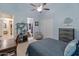 Bedroom with built-in shelving and ensuite bathroom at 12519 W Bajada Rd, Peoria, AZ 85383