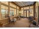 Relaxing covered patio with seating area and access to the backyard at 12519 W Bajada Rd, Peoria, AZ 85383