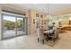 Dining area with sliding doors to backyard and views to kitchen at 12519 W Bajada Rd, Peoria, AZ 85383