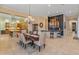 Open concept dining room with views into kitchen and bar area at 12519 W Bajada Rd, Peoria, AZ 85383