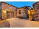 Attached two-car garage with stone and stucco exterior at 12519 W Bajada Rd, Peoria, AZ 85383