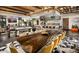 Large great room with a live edge dining table and modern decor at 12519 W Bajada Rd, Peoria, AZ 85383