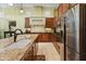 Modern kitchen with granite island, stainless steel appliances, and ample cabinetry at 12519 W Bajada Rd, Peoria, AZ 85383