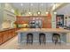 Spacious kitchen featuring granite countertops, ample cabinetry, and an island with seating at 12519 W Bajada Rd, Peoria, AZ 85383